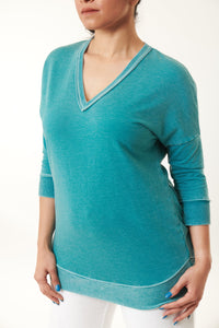 three quarters sleeve burn out knit pullover in turquoise-