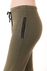 Capote, fleece jogger pants with faux leather black trim in army green-