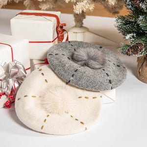 embroidered wool beret with faux fur pom-